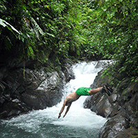 Diving_under_waterfall_Costa_Rica