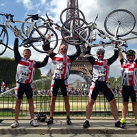 London_to_Paris_Eiffel_Tower_Cyclists.jpg