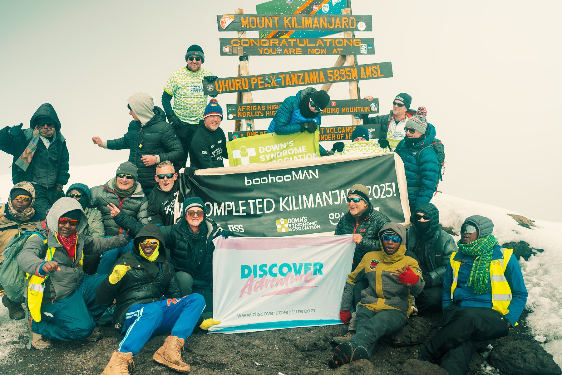 Aitch's Kilimanjaro climb with Discover Adventure - Team at Summit. Credit: Aaron Fitzmaurice