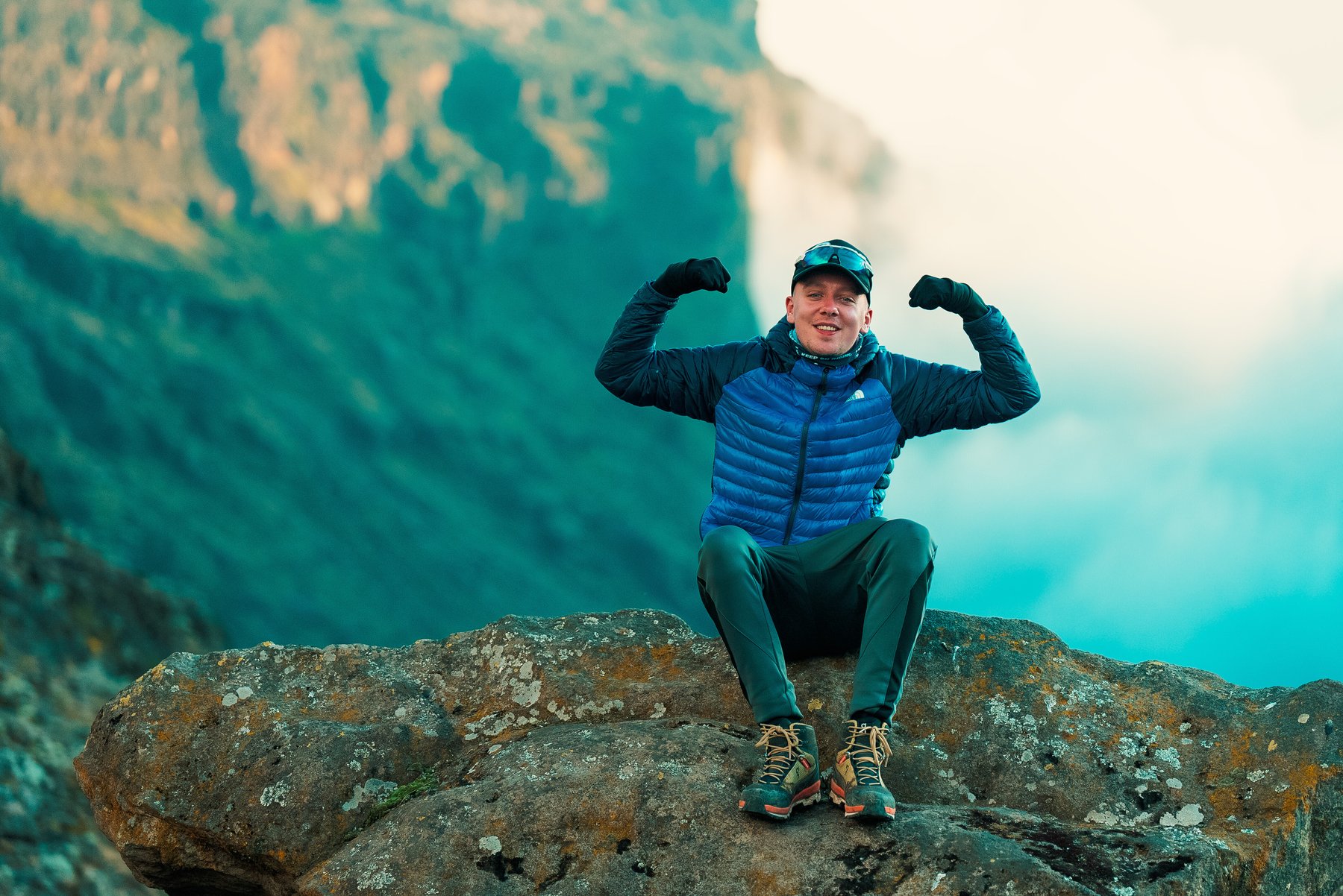 Aitch's Kilimanjaro climb with Discover Adventure - Aitch power pose on Kilimanjaro. Credit: Aaron Fitzmaurice